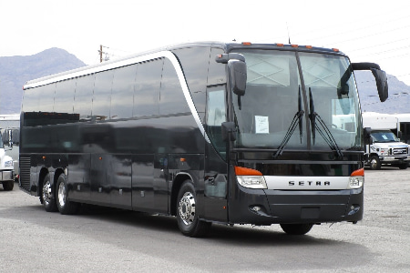 a black Colorado Royalty Charters charter bus